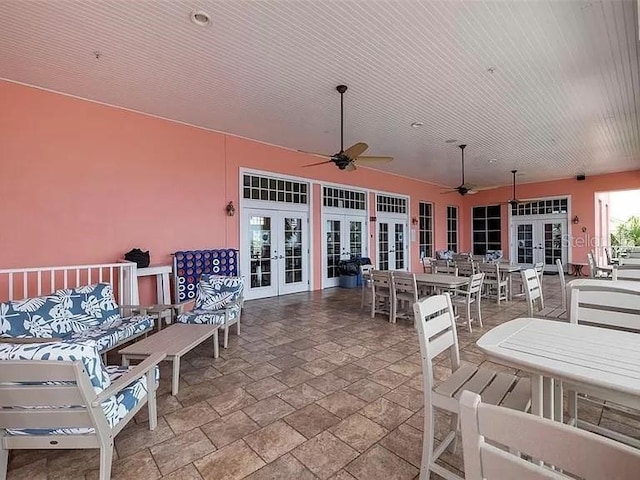 view of patio featuring ceiling fan, french doors, and outdoor dining area