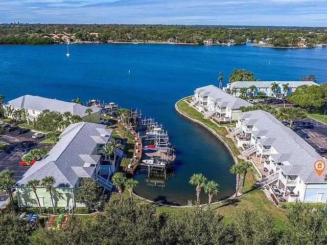 birds eye view of property featuring a water view and a residential view