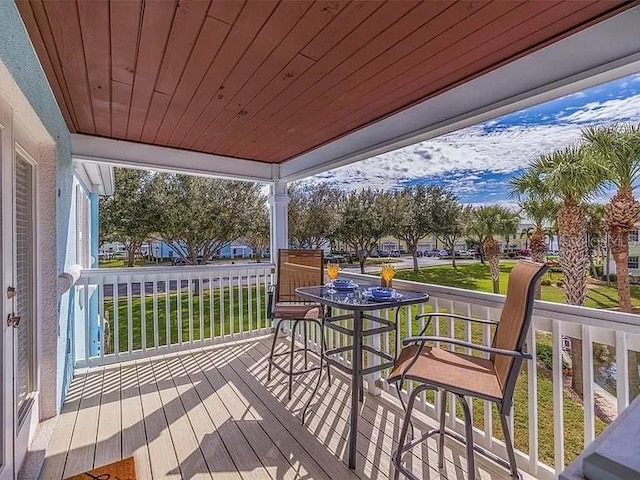 wooden terrace featuring covered porch