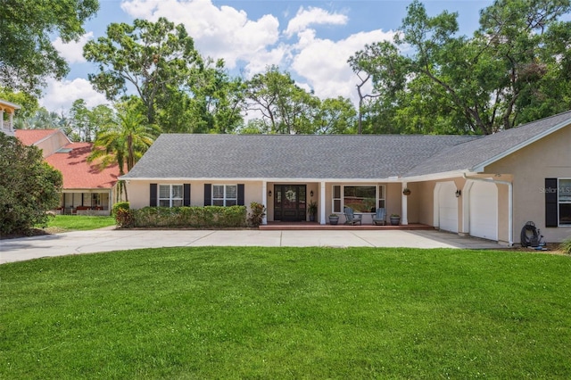 3906 Floyd Rd, Tampa, FL 33618 - ranch-style home with a front lawn, stucco siding, and roof with shingles