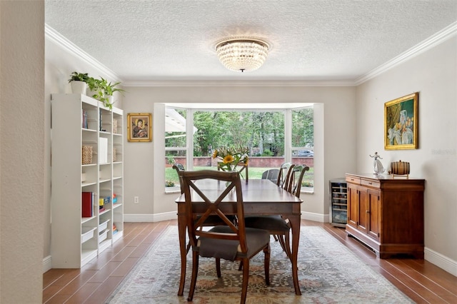 3906 Floyd Rd, Tampa, FL 33618 - dining room with a textured ceiling, wine cooler, ornamental molding, wood finished floors, and baseboards