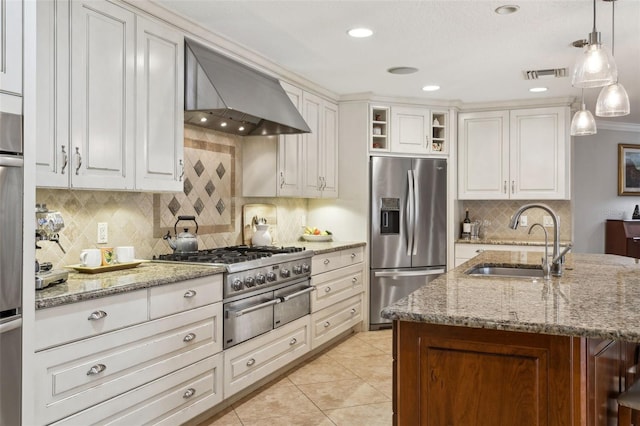 3906 Floyd Rd, Tampa, FL 33618 - kitchen with stainless steel refrigerator with ice dispenser, a sink, wall chimney range hood, tasteful backsplash, and light stone countertops