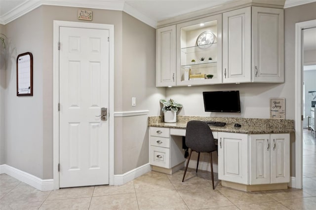 3906 Floyd Rd, Tampa, FL 33618 - office featuring built in desk, ornamental molding, baseboards, and light tile patterned floors
