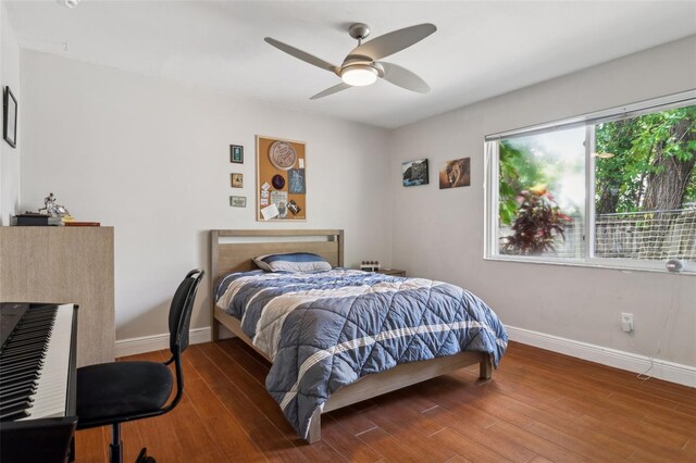 3906 Floyd Rd, Tampa, FL 33618 - bedroom featuring baseboards, wood finished floors, and a ceiling fan