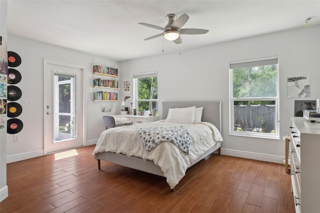 3906 Floyd Rd, Tampa, FL 33618 - bedroom with wood finished floors, baseboards, access to exterior, and a ceiling fan