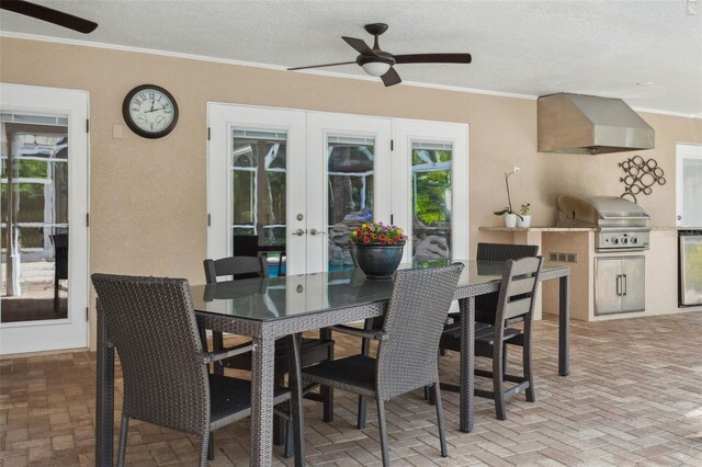 3906 Floyd Rd, Tampa, FL 33618 - view of patio with french doors, ceiling fan, and outdoor dining area