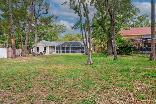 3906 Floyd Rd, Tampa, FL 33618 - view of yard with a lanai and a detached carport