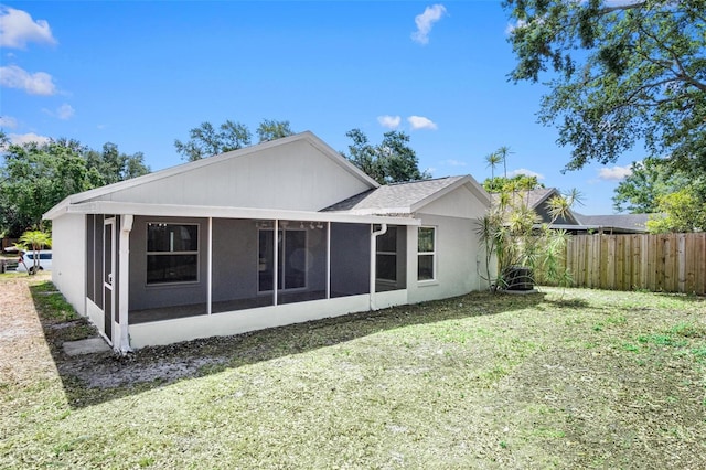 13613 Laraway Dr, Riverview, FL 33579 - back of house featuring a sunroom and stucco siding