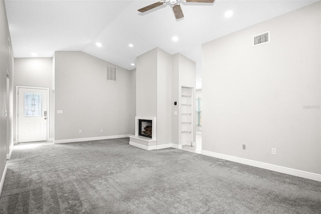 13613 Laraway Dr, Riverview, FL 33579 - unfurnished living room featuring carpet floors, ceiling fan, high vaulted ceiling, a multi sided fireplace, and baseboards