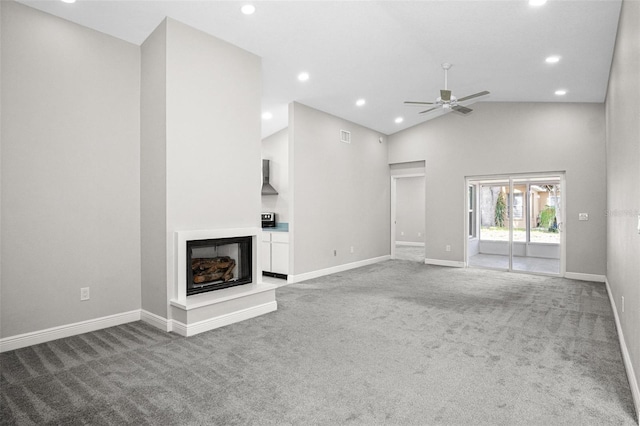 13613 Laraway Dr, Riverview, FL 33579 - unfurnished living room featuring carpet floors, a ceiling fan, recessed lighting, baseboards, and a glass covered fireplace