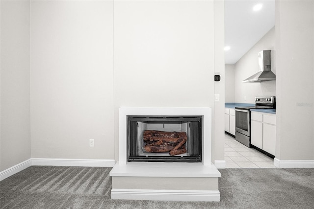 13613 Laraway Dr, Riverview, FL 33579 - detailed view of stainless steel electric stove, wall chimney range hood, carpet floors, baseboards, and recessed lighting