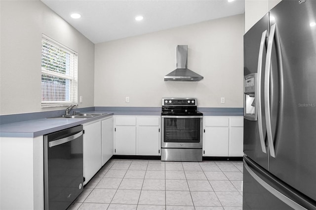 13613 Laraway Dr, Riverview, FL 33579 - kitchen with stainless steel appliances, wall chimney exhaust hood, a sink, white cabinetry, and recessed lighting