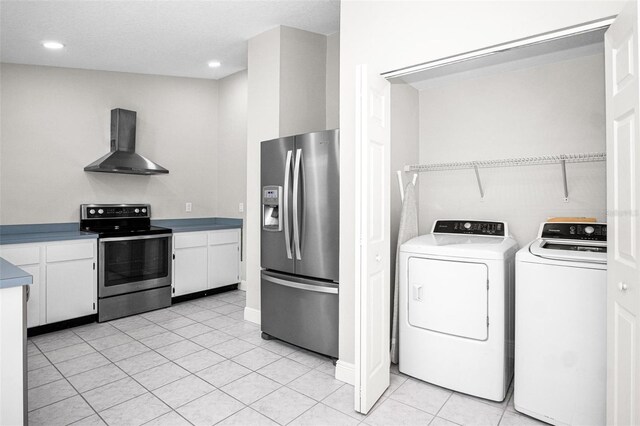 13613 Laraway Dr, Riverview, FL 33579 - laundry room with washer and clothes dryer, light tile patterned flooring, and recessed lighting