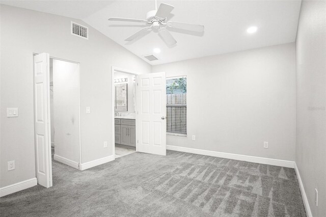 13613 Laraway Dr, Riverview, FL 33579 - unfurnished bedroom featuring a walk in closet, carpet flooring, vaulted ceiling, baseboards, and recessed lighting