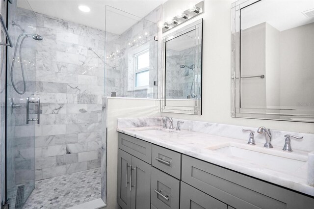 13613 Laraway Dr, Riverview, FL 33579 - bathroom with a stall shower, double vanity, and recessed lighting
