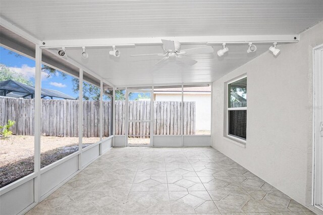 13613 Laraway Dr, Riverview, FL 33579 - unfurnished sunroom featuring rail lighting and a ceiling fan