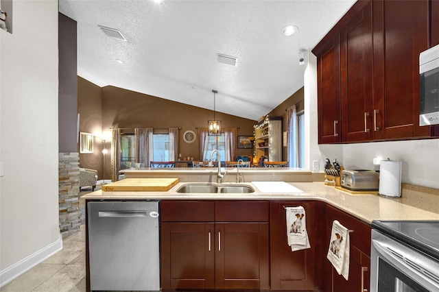 kitchen featuring a sink, light countertops, a peninsula, stainless steel dishwasher, and vaulted ceiling