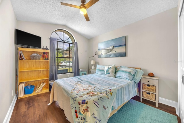 bedroom with baseboards, a textured ceiling, wood finished floors, and vaulted ceiling