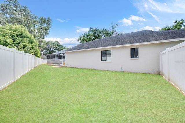 view of yard with a fenced backyard