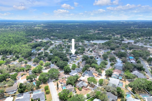 bird's eye view featuring a view of trees and a residential view