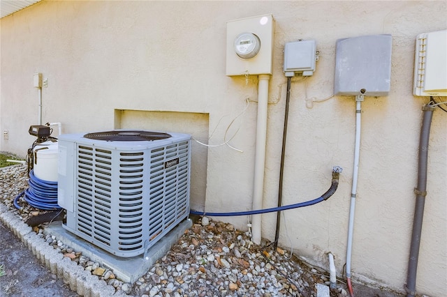 2604 Clareside Dr, Valrico, FL 33596 - exterior view of central AC unit, stucco siding, and electric meter