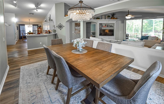 2604 Clareside Dr, Valrico, FL 33596 - dining room with arched walkways, a chandelier, ceiling fan, and baseboards
