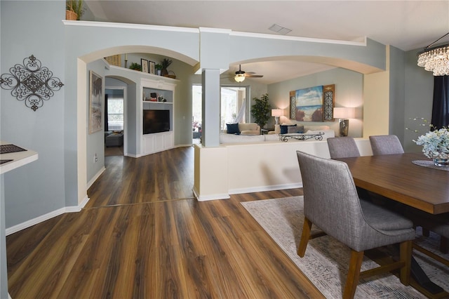 2604 Clareside Dr, Valrico, FL 33596 - dining area featuring wood finished floors, arched walkways, ornamental molding, baseboards, and a ceiling fan