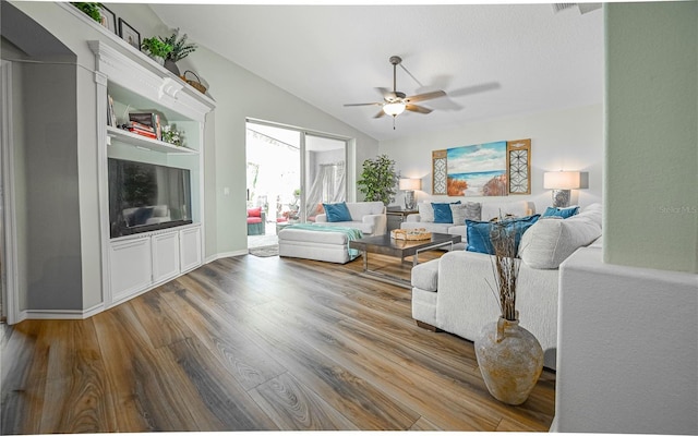 2604 Clareside Dr, Valrico, FL 33596 - living area featuring ceiling fan, wood finished floors, and vaulted ceiling