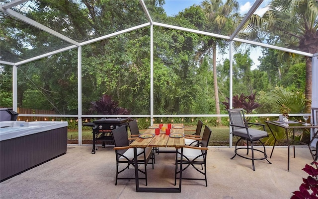2604 Clareside Dr, Valrico, FL 33596 - sunroom with a hot tub and outdoor dining space
