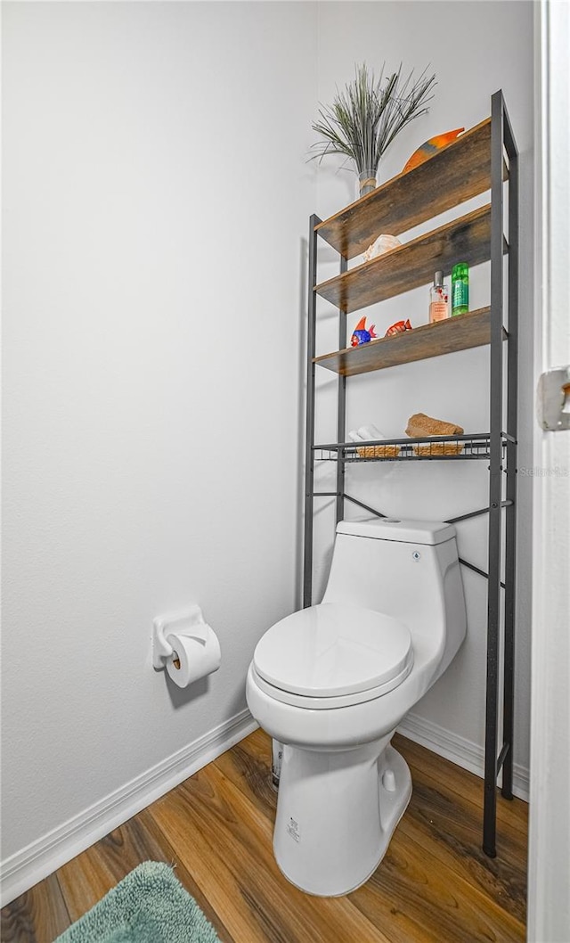 2604 Clareside Dr, Valrico, FL 33596 - bathroom with baseboards, wood finished floors, and toilet