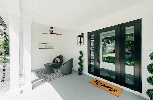 doorway to property with french doors and ceiling fan