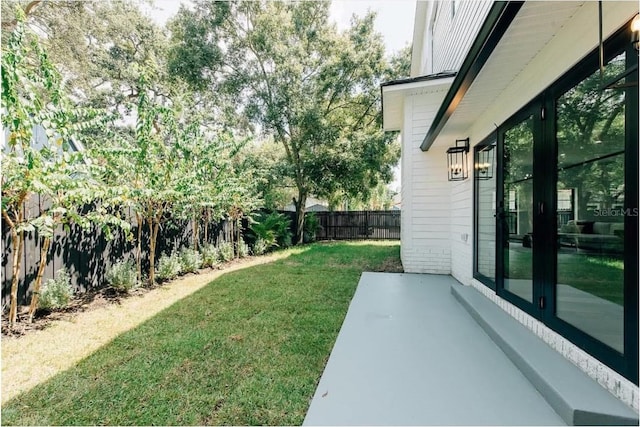 view of yard featuring a fenced backyard and a patio