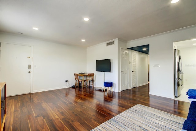 1115 Rue Des Chateaux Unit 2B, South Pasadena, FL 33707 - living area featuring ornamental molding, recessed lighting, wood finished floors, and visible vents