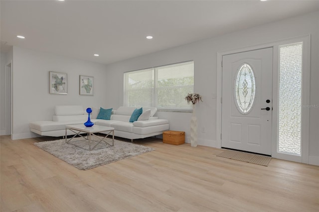 entrance foyer featuring recessed lighting, baseboards, and wood finished floors