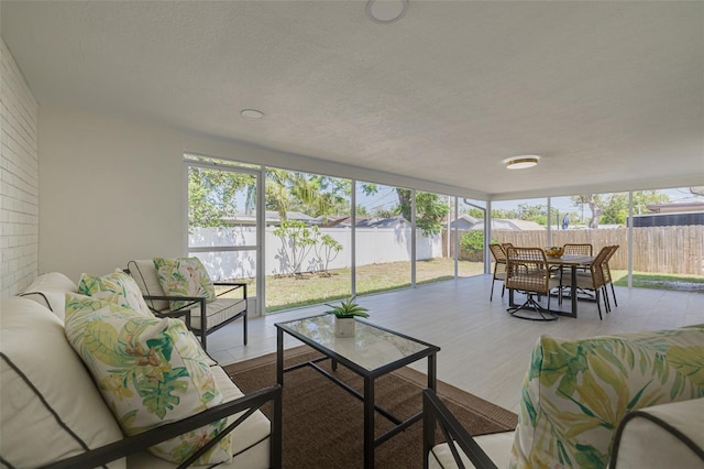 sunroom / solarium featuring plenty of natural light