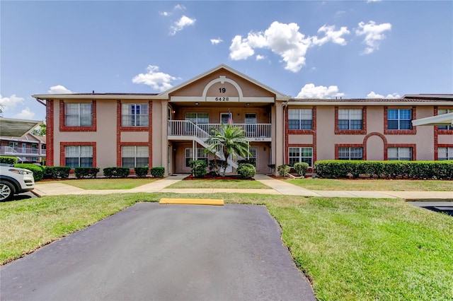 6428 Gloria Dr Unit 21, New Port Richey, FL 34653 - view of property with uncovered parking