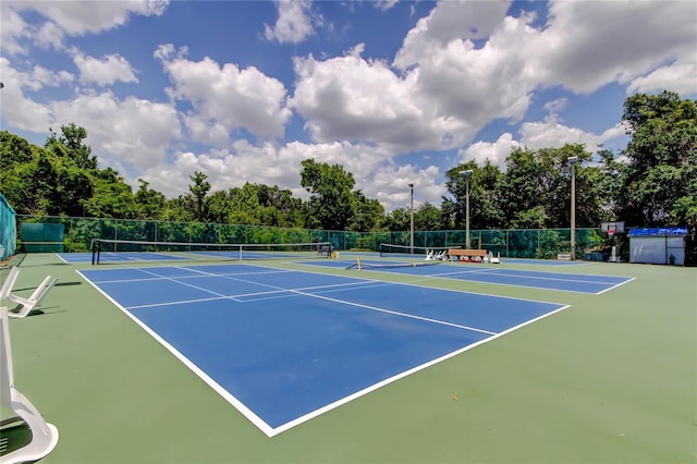 6428 Gloria Dr Unit 21, New Port Richey, FL 34653 - view of tennis court with fence and community basketball court