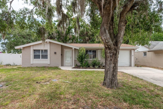3601 Grayton Dr, New Port Richey, FL 34652 - view of front facade with driveway, stucco siding, and an attached garage