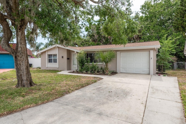 3601 Grayton Dr, New Port Richey, FL 34652 - view of front of home featuring driveway, an attached garage, and stucco siding