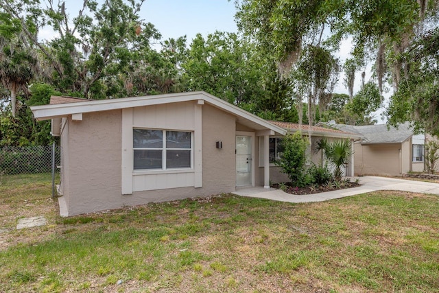 3601 Grayton Dr, New Port Richey, FL 34652 - view of front facade with stucco siding