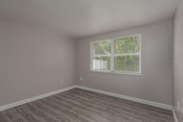 3601 Grayton Dr, New Port Richey, FL 34652 - unfurnished room featuring dark wood-style floors and baseboards