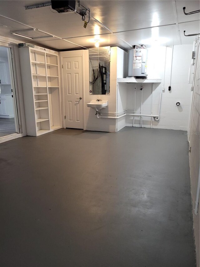 3601 Grayton Dr, New Port Richey, FL 34652 - basement with water heater and a sink