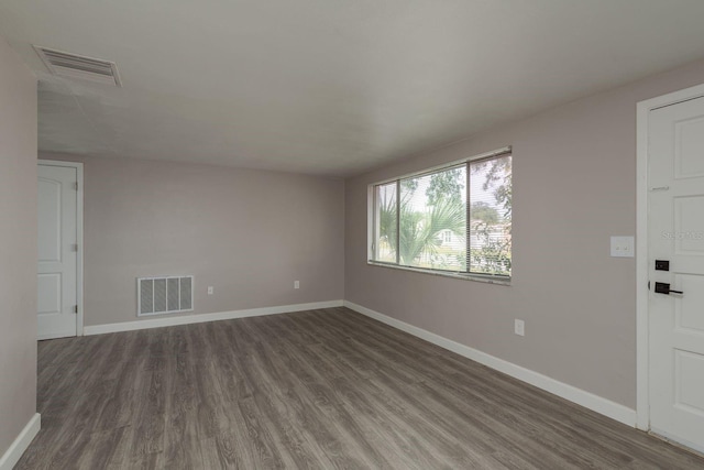 3601 Grayton Dr, New Port Richey, FL 34652 - empty room with wood finished floors and baseboards