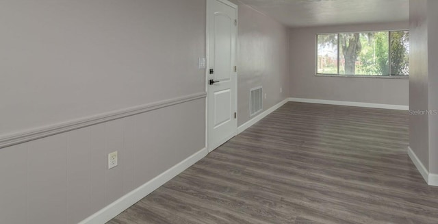 3601 Grayton Dr, New Port Richey, FL 34652 - corridor with dark wood-style flooring and baseboards