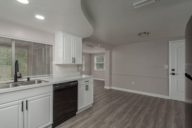3601 Grayton Dr, New Port Richey, FL 34652 - kitchen with dishwasher, a sink, light countertops, wood finished floors, and recessed lighting