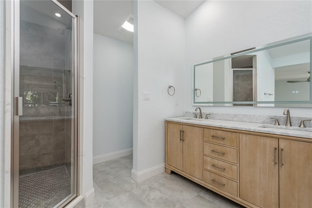 1152 Jackmar Rd, Dunedin, FL 34698 - bathroom featuring double vanity, a shower stall, baseboards, and a ceiling fan