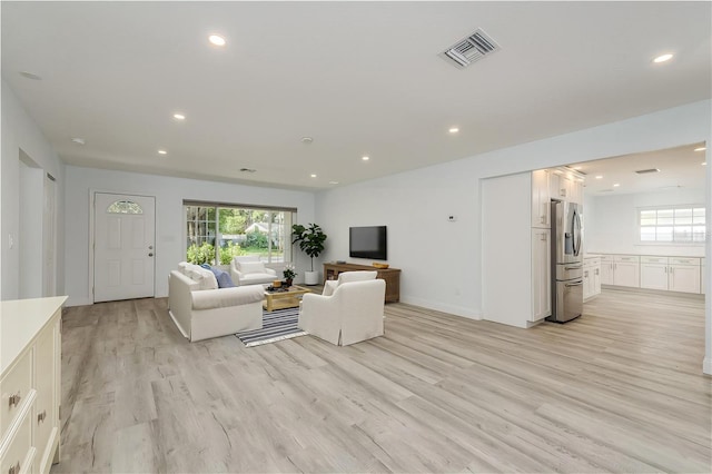 1152 Jackmar Rd, Dunedin, FL 34698 - living area with light wood-style flooring, recessed lighting, and baseboards
