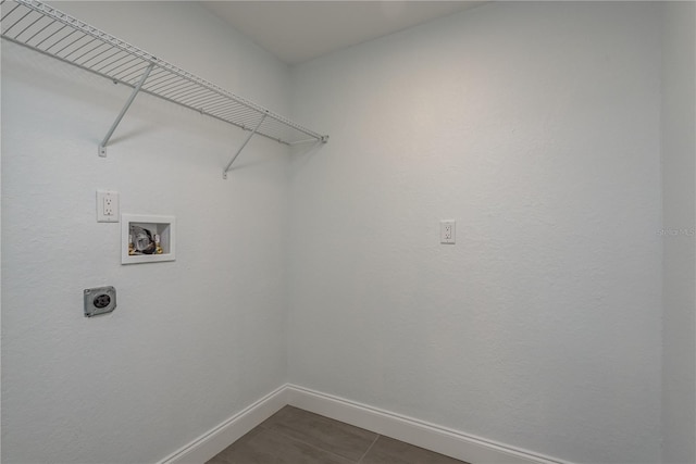 1152 Jackmar Rd, Dunedin, FL 34698 - laundry room with hookup for an electric dryer, baseboards, and washer hookup
