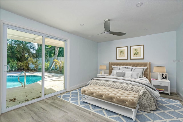 1152 Jackmar Rd, Dunedin, FL 34698 - bedroom featuring access to exterior, wood finished floors, baseboards, and ceiling fan