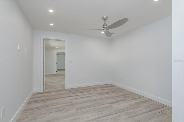 1152 Jackmar Rd, Dunedin, FL 34698 - spare room featuring a ceiling fan, recessed lighting, light wood finished floors, and baseboards